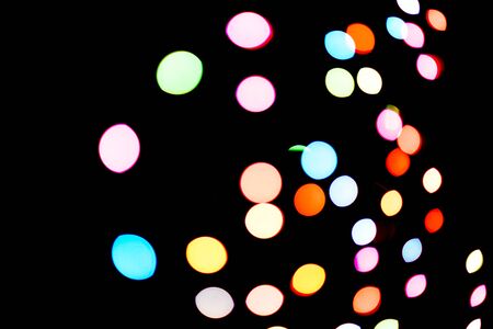 Abstract colorful defocused circular facula holiday bokeh. Abstract Christmas and new year backgroundの写真素材
