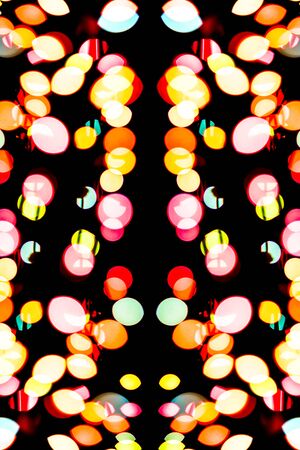 Abstract colorful defocused circular facula holiday bokeh. Abstract Christmas and new year backgroundの写真素材