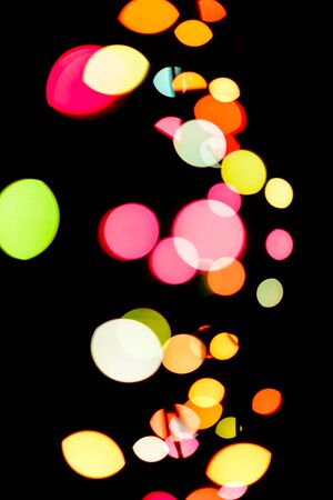 Abstract colorful defocused circular facula holiday bokeh. Abstract Christmas and new year backgroundの写真素材