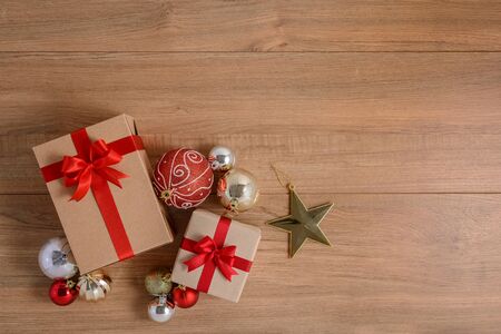 Gifts boxes with festive ribbons on wooden background. holiday, giving, new year, christmas, birthday, celebration, anniversary with copy spaceの写真素材