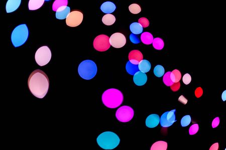 Abstract colorful defocused circular facula holiday bokeh. Abstract Christmas and new year backgroundの写真素材