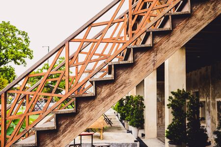 outdoor old wooden stairs with staircase railing. handrails, balustersの写真素材