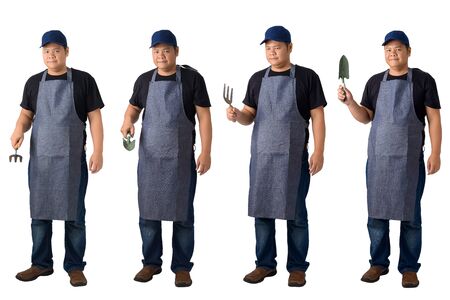 collection set of Full body portrait of a worker man or Serviceman in Black shirt and apron is holding Shovel for Cultivators isolated on white background. Hand-made, DIY, Garden conceptの写真素材