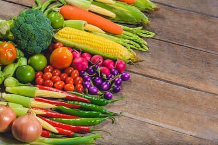 Backgroud of fresh food tasty and healthy varis vegetables are on the wooden table with space for your messageの写真素材