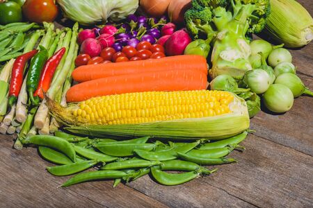 Backgroud group of fresh food tasty and healthy varis vegetables are on the wooden tableの写真素材