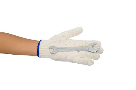 asian woman worker with protective gloves hand holding wrench isolated on white backgroundの写真素材