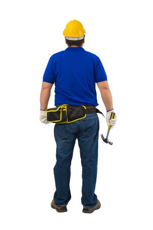 Back view construction man workers in blue shirt with Protective gloves, helmet with tool belt hand holding hammer isolated on white backround with clipping pathの写真素材