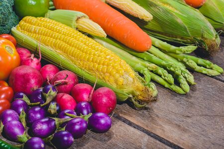 Backgroud of fresh food tasty and healthy varis vegetables are on the wooden table with space for your messageの写真素材