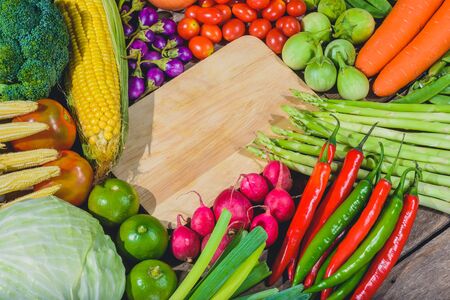 Backgroud of fresh food tasty and healthy varis vegetables are on the wooden table with space for your messageの写真素材