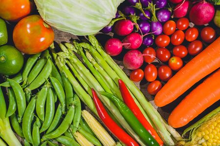 Backgroud group of fresh food tasty and healthy varis vegetables are on the wooden tableの写真素材