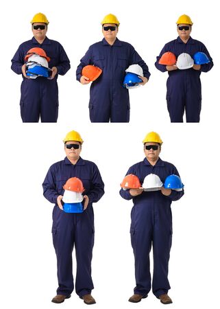 collection set of Full body portrait of a worker in Mechanic Jumpsuit holding helmet multicolor with Safety goggles isolated on white background clipping pathの写真素材