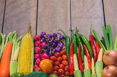 Backgroud of fresh food tasty and healthy varis vegetables are on the wooden table with space for your messageの写真素材