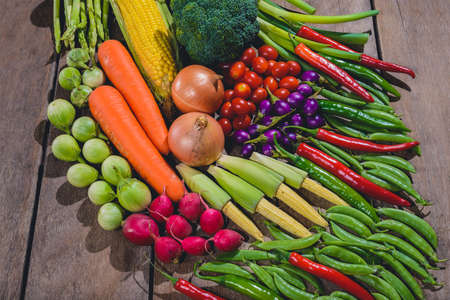 Backgroud group of fresh food tasty and healthy varis vegetables are on the wooden tableの写真素材