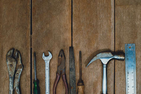 Top view of old instruments constructor or renovation for build and repair house on rustic grunge wooden backgroundの写真素材
