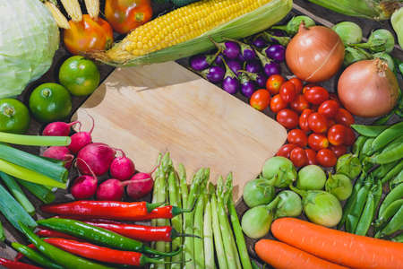Backgroud of fresh food tasty and healthy varis vegetables are on the wooden table with space for your messageの写真素材