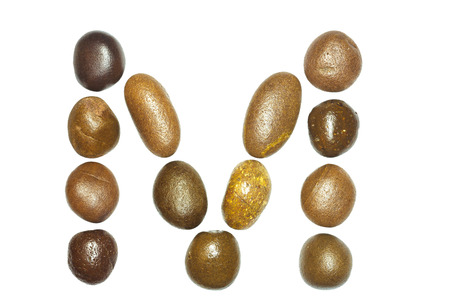 collection of letters of sea stones close-up isolated on white backgroundの写真素材