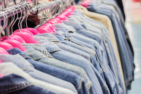 Jean clothes on racks at the show.Shallow dofの写真素材