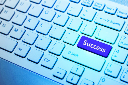 Keyboard with blue Success button, business conceptの写真素材