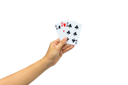 Playing cards in hand isolated on white background