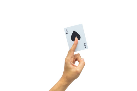 Playing cards in hand isolated on white backgroundの写真素材