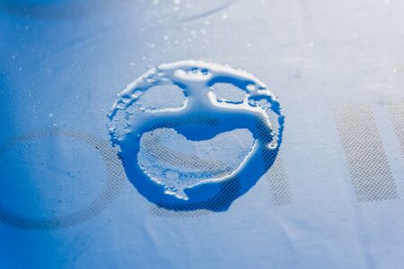Sad face drawn over condensed table