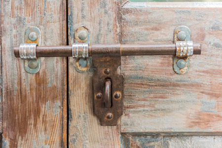 Old latch on a wooden door