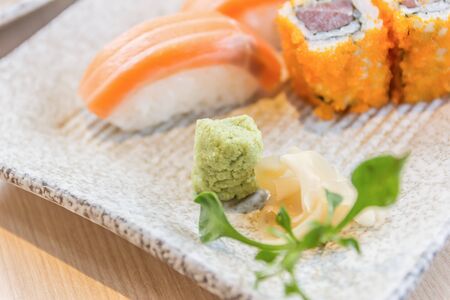 homemade sushi with salmon, cream cheese Philadelphia, Japanese omelette, cucumber and wasabi. selective focusの写真素材