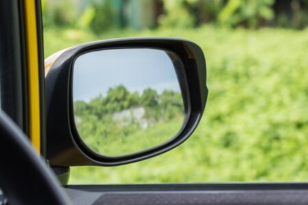 side rear-view mirror on a modern carの写真素材