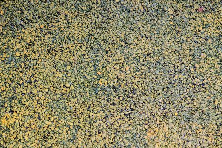 background made of a closeup of a pile of pebblesの写真素材