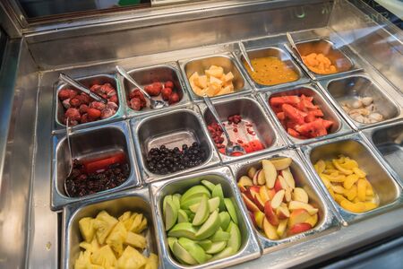 Various fresh fruit and vegetable salad bar healthy itemsの写真素材