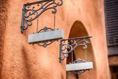Old wooden sign on the chains.の写真素材
