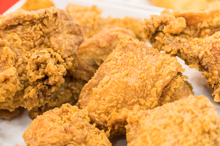 Fried chicken wings on wooden table. Breaded Crispy fried kentucky chicken tasty dinnerの写真素材