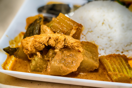 Chicken Curry and rice on a white plate.の写真素材