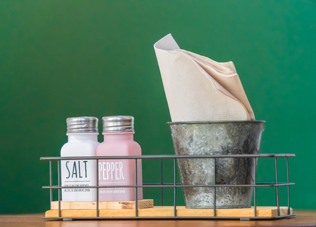 Clean white napkins with salt cellar and toothpick.の写真素材