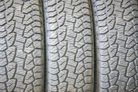 Car tires at warehouse in tire store.