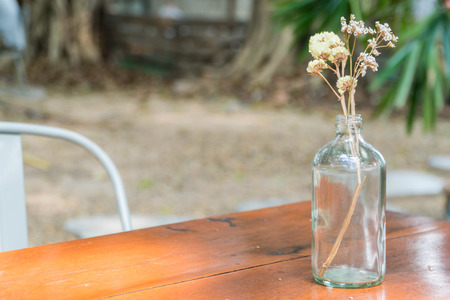 dry flower in bottle vase at coffee cafeの写真素材