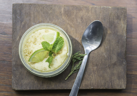 Lemon cheese cake on wooden plate.の写真素材