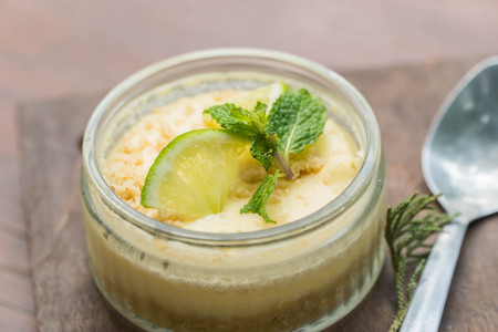 Lemon cheese cake on wooden plate.の写真素材