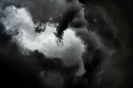 Dark god face in storm cloud formation with eye of hurricane in the middle.の写真素材