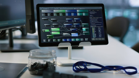 Closeup of a computer monitor in a modern office with charts and graphs