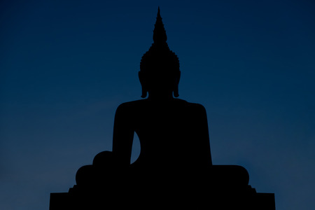 Silhouette buddha statue in twilight time, respectation of buddhist in Thailand, clipping path included.の写真素材