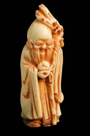Netsuke isolated on black