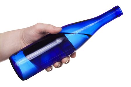 Hand holding the blue bottle. Isolated on white [with clipping path].の写真素材