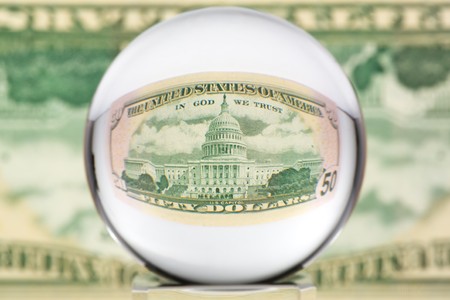 Fifty dollar banknote through glass sphere. Blur background.の写真素材