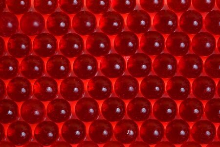Texture from red pills (capsules).の写真素材