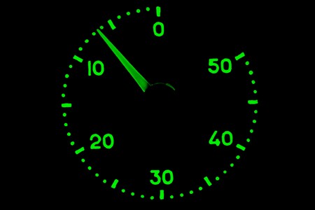 Green shine dial with an arrow on a black background