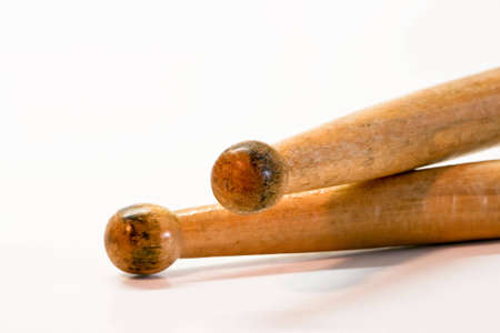 A closeup of a wood pair of drum sticksの写真素材
