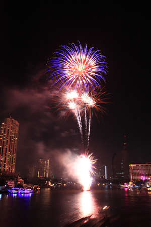 Fireworks over the river in thailandの写真素材