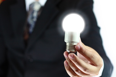 light bulb in hand of business manの写真素材