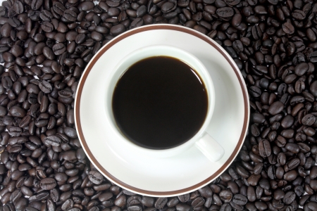 coffee cup with brown coffee beans textureの写真素材